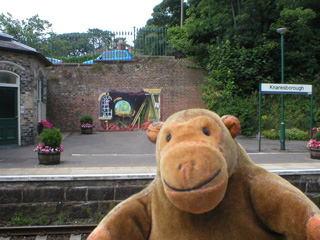 Mr Monkey looking at the mural on Knaresborough station
