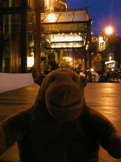 Mr Monkey sitting on a table outside the Harrogate Brasserie