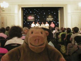 Mr Monkey attending a panel of authors