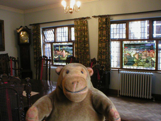 Mr Monkey looking at stained glass in the Governor's Parlour