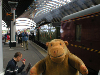Mr Monkey looking at the Scarborough Spa Express stationary at York