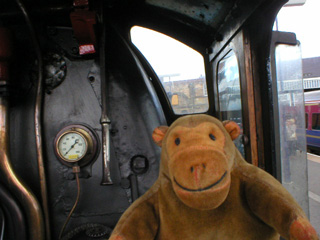 Mr Monkey looking out of the right hand window of the Green Arrow