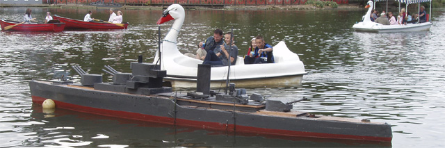 A pedalo in the shape of a swan about to run into the enemy battleship