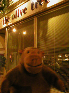 Mr Monkey outside The Olive Tree restaurant