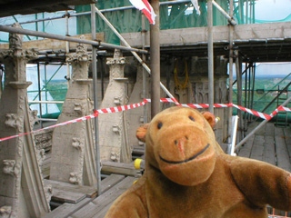 Mr Monkey looking at a row of finials