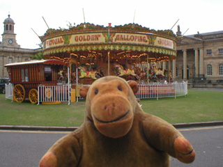 Mr Monkey looking at a carousel