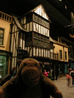 Mr Monkey looking at buildings in Kirkgate