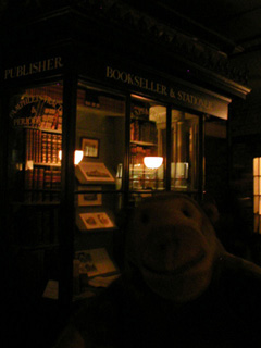 Mr Monkey outside a booksellers shop