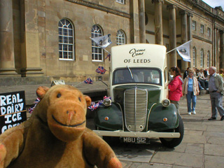 Mr Monkey looking at a vintage ice cream van outside the Castle Museum