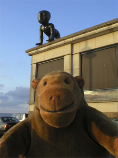 Mr Monkey looking at a Baby on the roof of the casino