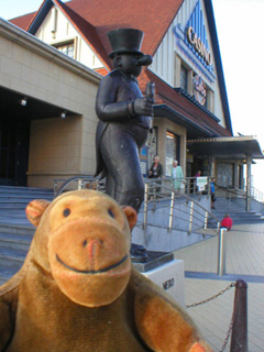 Mr Monkey looking at a statue of Nero