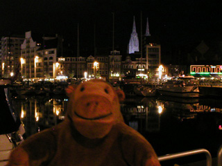 Mr Monkey looking at Ostende in the dark