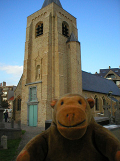 Mr Monkey looking at the church of Our Lady of the Dunes