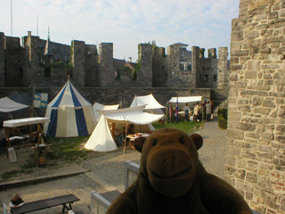 Mr Monkey looking down on the castle courtyard from the steps of the keep