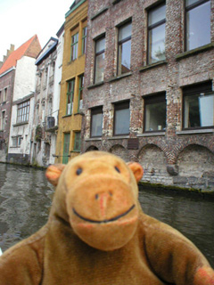 Mr Monkey passing old canal warehouses