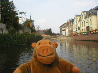 Mr Monkey looking at a large earth bank blocking the canal