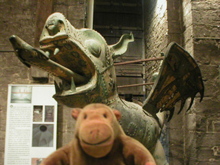 Mr Monkey looking at the nineteenth century dragon