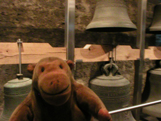 Mr Monkey looking at damaged bells from the carillon