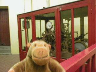 Mr Monkey looking at the clock mechanism