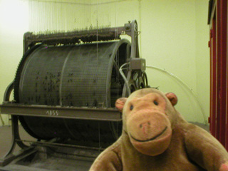 Mr Monkey looking at the music box mechanism