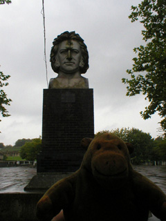 Mr Monkey looking at a bust of Joseph Paxton