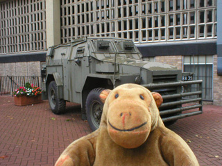 Mr Monkey looking at a Humber Pig outside the National Army Museum