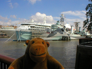 Mr Monkey looking at the HMS Belfast and a cruise ship