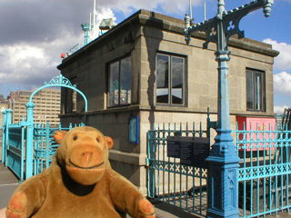 Mr Monkey looking at a post WW2 control hut on Tower Bridge