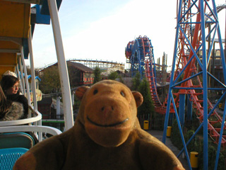 Mr Monkey on the monorail beside the Revolution
