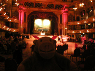 Mr Monkey watching people dancing in the ballroom